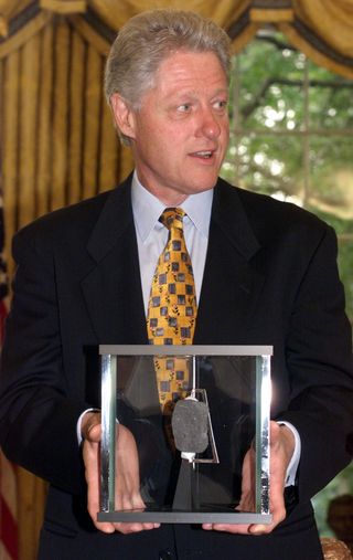 president-bill-clinton-holds-a-moon-rock-presented-to-him-news-photo-1611281502..jpeg
