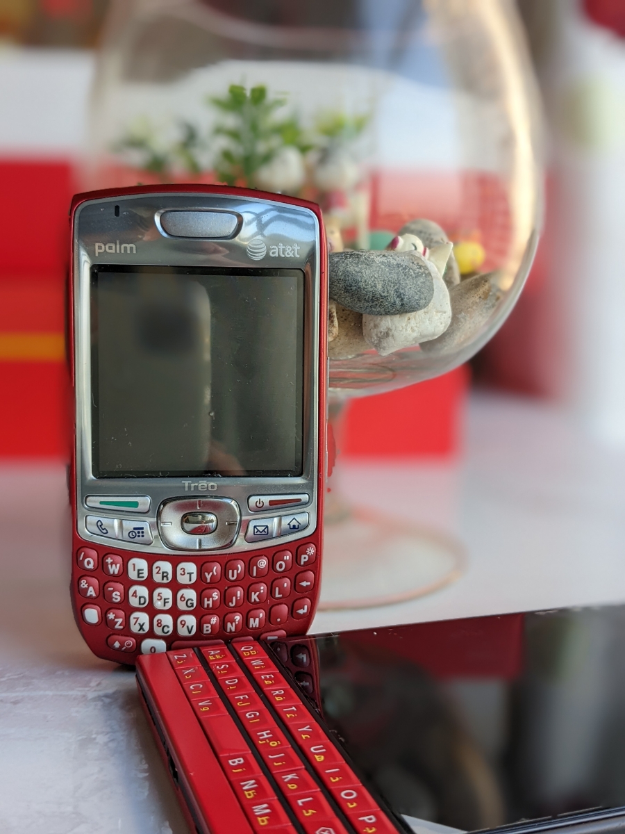 Palm Treo 680 vs Blackberry Passport Red.